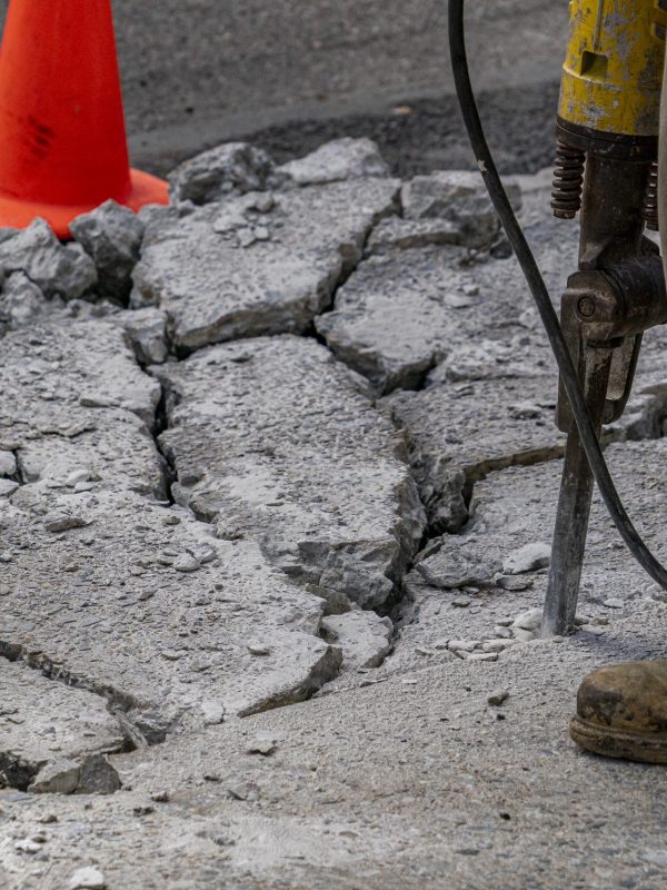 Jackhammer breaking concrete